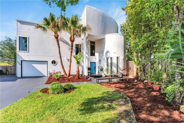 4809 Neyrey Dr, Metairie, LA 70002 - view of front of house featuring driveway, an attached garage, and stucco siding