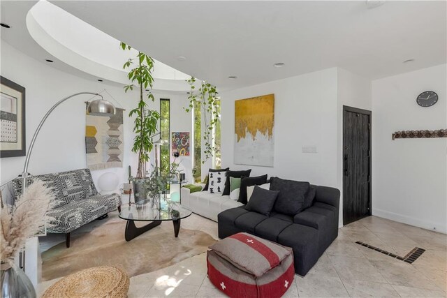 4809 Neyrey Dr, Metairie, LA 70002 - tiled living room with baseboards