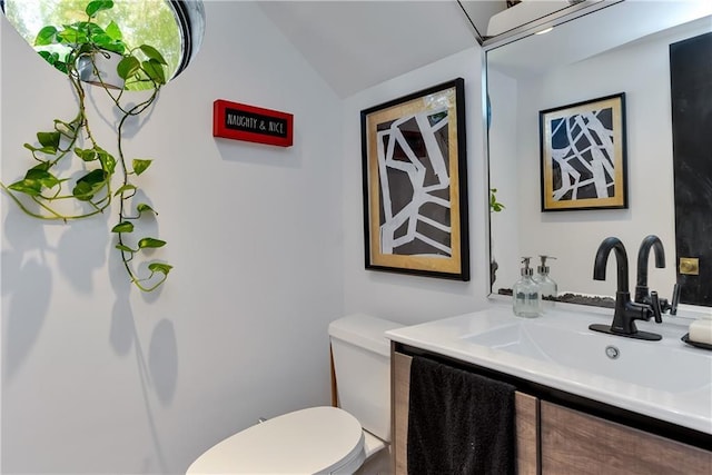 4809 Neyrey Dr, Metairie, LA 70002 - bathroom featuring vanity and lofted ceiling