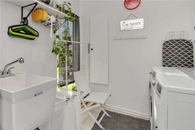 4809 Neyrey Dr, Metairie, LA 70002 - laundry area with washer and clothes dryer and baseboards