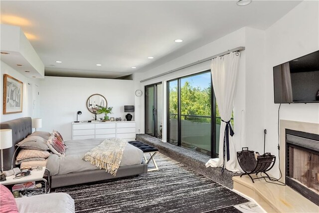 4809 Neyrey Dr, Metairie, LA 70002 - bedroom featuring access to outside, a fireplace with raised hearth, and recessed lighting