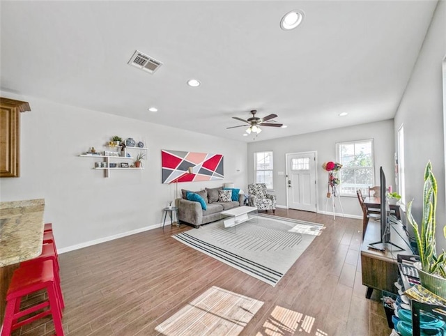 2738 Cleveland Ave, New Orleans, LA 70119 - living room with baseboards, wood finished floors, visible vents, and recessed lighting