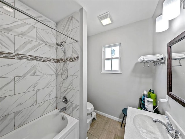2738 Cleveland Ave, New Orleans, LA 70119 - bathroom with shower / bathing tub combination, baseboards, vanity, and toilet