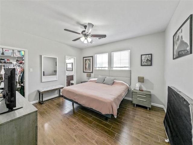 2738 Cleveland Ave, New Orleans, LA 70119 - bedroom featuring a ceiling fan, wood finished floors, a closet, a spacious closet, and baseboards