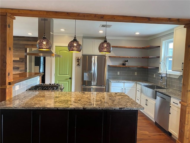 kitchen featuring a sink, decorative backsplash, stone countertops, open shelves, and appliances with stainless steel finishes