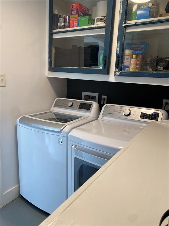 laundry room with laundry area and separate washer and dryer