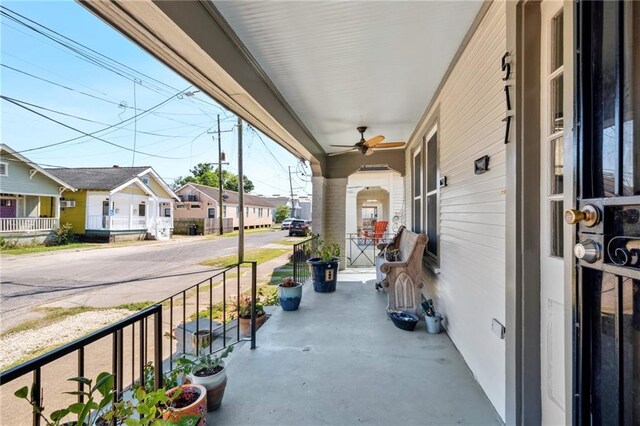 517 S Murat St, New Orleans, LA 70119 - covered porch with ceiling fan and a residential view