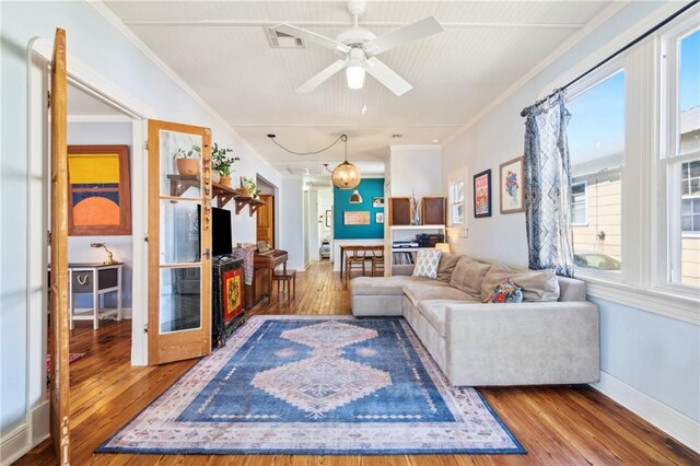 517 S Murat St, New Orleans, LA 70119 - living room featuring hardwood / wood-style floors, crown molding, and a ceiling fan