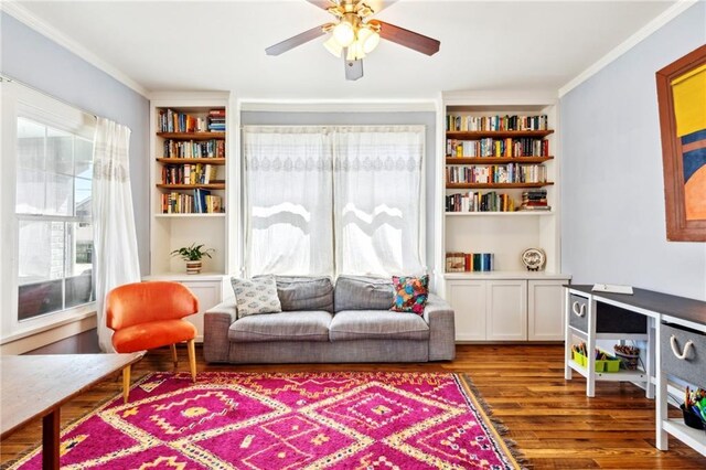 517 S Murat St, New Orleans, LA 70119 - living area with ornamental molding, wood finished floors, ceiling fan, and built in features