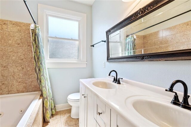 517 S Murat St, New Orleans, LA 70119 - bathroom featuring a combined bath / shower with jetted tub, double vanity, and tile patterned floors
