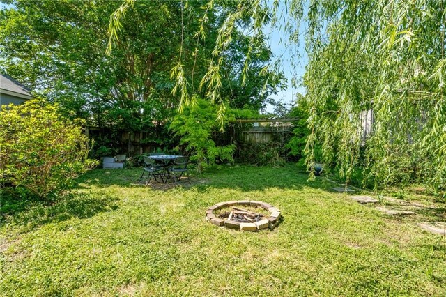 517 S Murat St, New Orleans, LA 70119 - fenced yard with a fire pit