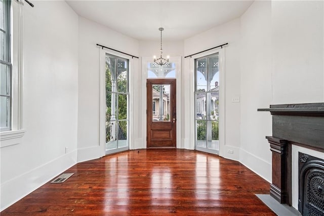 2642-4444 Lepage St, New Orleans, LA 70119 - entryway featuring a chandelier and hardwood / wood-style floors