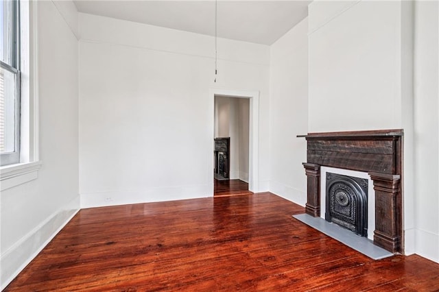 2642-4444 Lepage St, New Orleans, LA 70119 - unfurnished living room featuring a fireplace with flush hearth and wood finished floors
