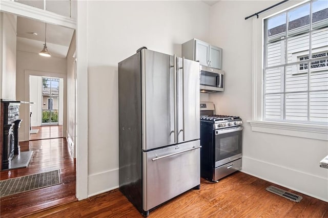 2642-4444 Lepage St, New Orleans, LA 70119 - kitchen with appliances with stainless steel finishes, wood finished floors, and healthy amount of natural light