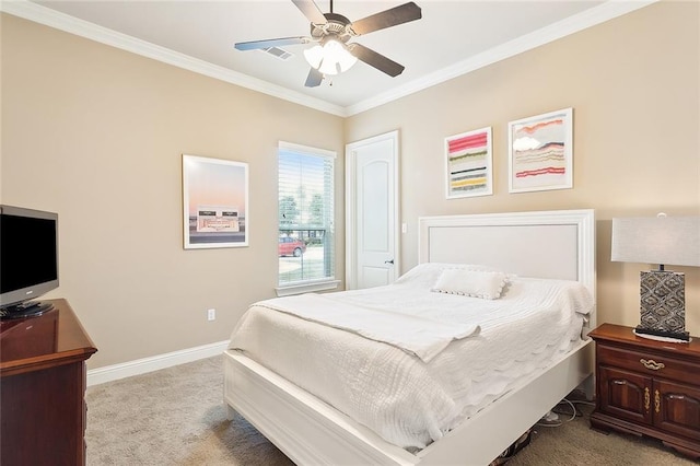 carpeted bedroom with baseboards, visible vents, crown molding, and a ceiling fan