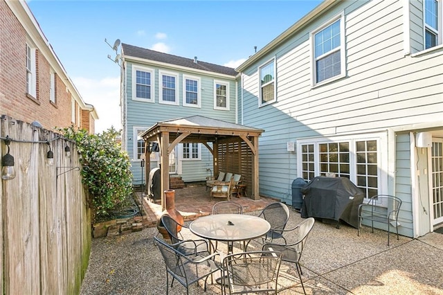 3439 Octavia St, New Orleans, LA 70125 - back of house with a gazebo, fence, a patio, and outdoor dining space