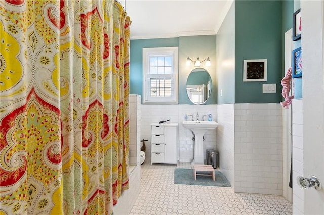 3439 Octavia St, New Orleans, LA 70125 - bathroom with toilet, a wainscoted wall, tile walls, curtained shower, and crown molding