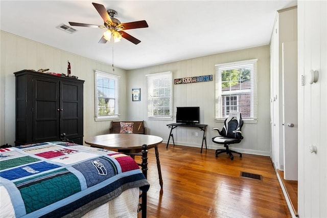 3439 Octavia St, New Orleans, LA 70125 - bedroom with multiple windows, visible vents, and wood finished floors
