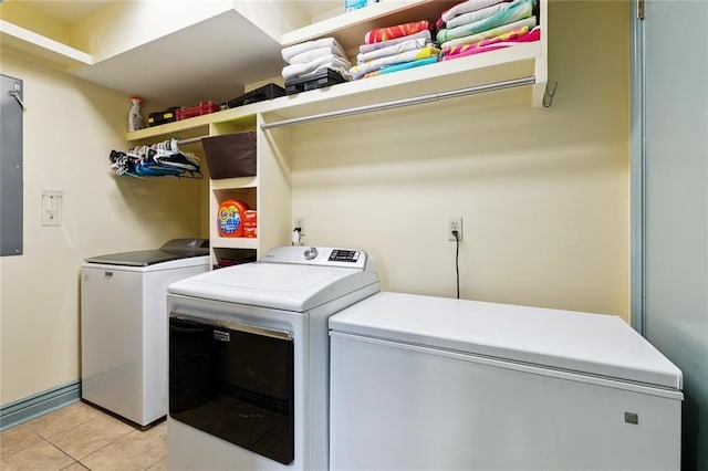 3439 Octavia St, New Orleans, LA 70125 - washroom featuring washing machine and dryer, laundry area, and light tile patterned flooring