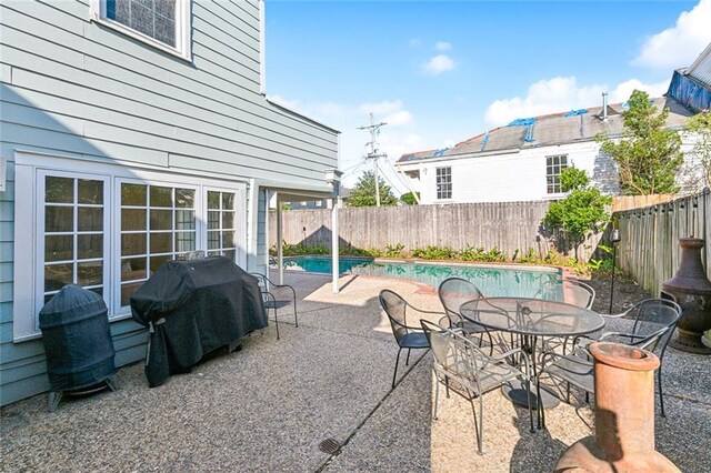 3439 Octavia St, New Orleans, LA 70125 - view of patio / terrace featuring a grill, a fenced backyard, and outdoor dining area