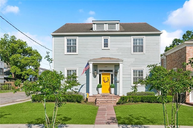 3439 Octavia St, New Orleans, LA 70125 - view of front facade featuring a shingled roof and a front yard