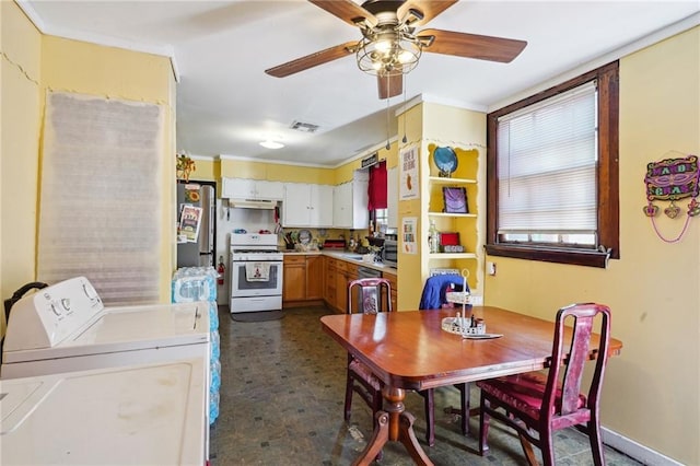 kitchen with under cabinet range hood, stainless steel appliances, visible vents, a ceiling fan, and washer and dryer
