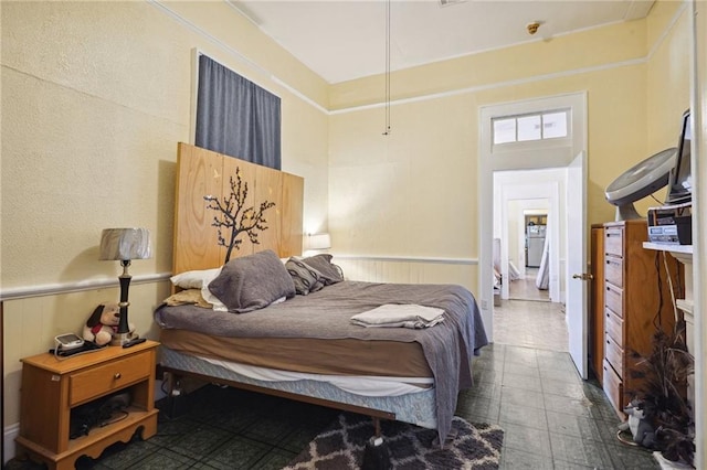bedroom with a wainscoted wall