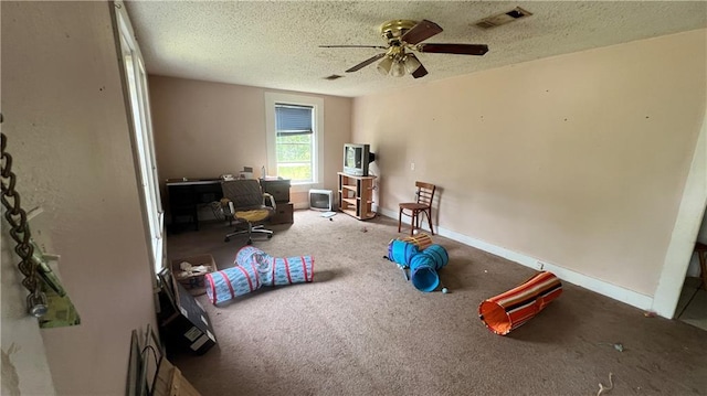 39202 Pine St, Pearl River, LA 70452 - rec room with visible vents, carpet flooring, a textured ceiling, and ceiling fan