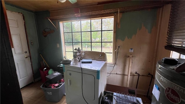 39202 Pine St, Pearl River, LA 70452 - washroom with water heater, laundry area, and washer / dryer
