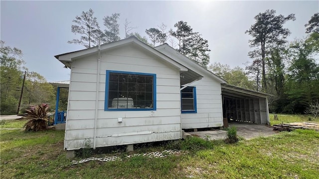 39202 Pine St, Pearl River, LA 70452 - view of property exterior with an attached carport