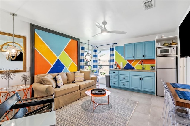 66 Carolyn Ct, Arabi, LA 70032 - living room featuring a ceiling fan and light tile patterned floors