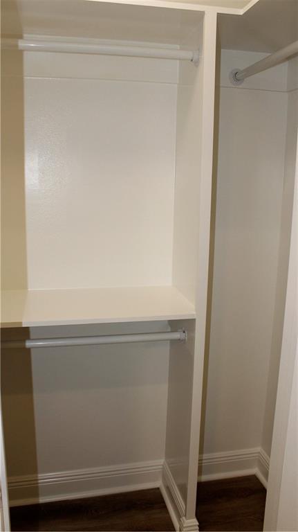 3810 Tall Pines Dr, New Orleans, LA 70131 - hall with baseboards, dark wood-style floors, and recessed lighting