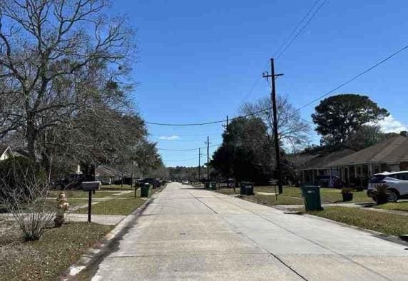 view of road with curbs and sidewalks