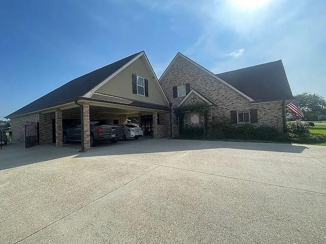 view of front of house with a carport and concrete driveway