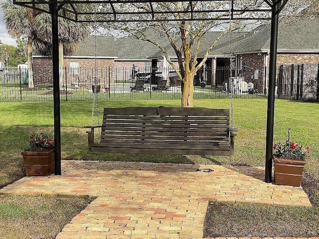 surrounding community featuring fence and a yard