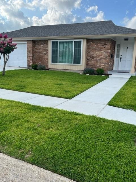 42 Boimare Ave, Kenner, LA 70065 - single story home with a front yard, brick siding, and an attached garage