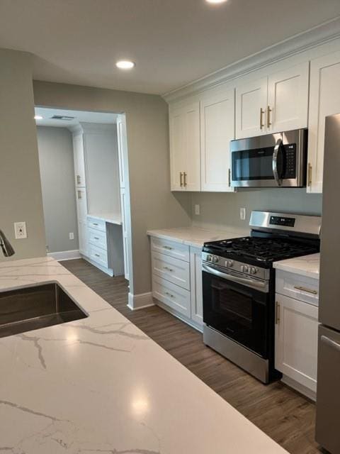 42 Boimare Ave, Kenner, LA 70065 - kitchen featuring stainless steel appliances, a sink, dark wood-style floors, white cabinetry, and recessed lighting