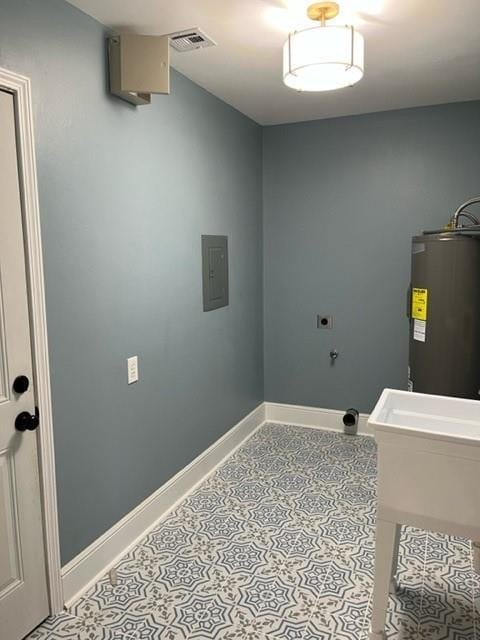 42 Boimare Ave, Kenner, LA 70065 - washroom with water heater, baseboards, hookup for an electric dryer, and tile patterned floors