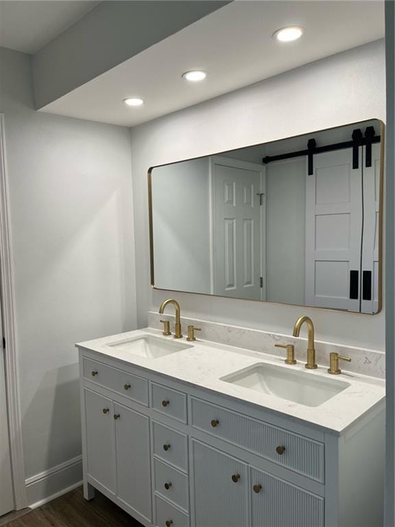 42 Boimare Ave, Kenner, LA 70065 - full bath featuring double vanity, wood finished floors, recessed lighting, and baseboards