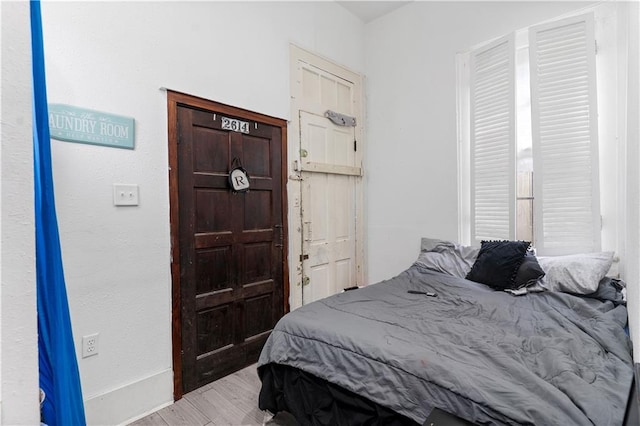 2612-14 Orleans Ave, New Orleans, LA 70119 - bedroom featuring baseboards and wood finished floors