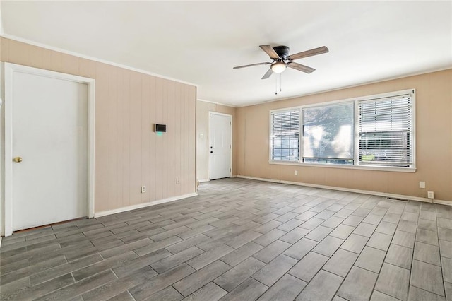 8936 Curran Blvd, New Orleans, LA 70127 - spare room featuring ornamental molding, baseboards, a ceiling fan, and wood finished floors