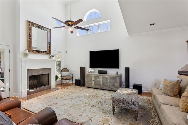 4344 Idaho Ave, Kenner, LA 70065 - living room featuring a wealth of natural light, a fireplace with flush hearth, ceiling fan, and a towering ceiling