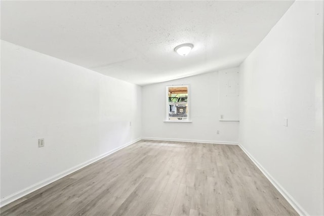 1279 Jaycee Dr, Slidell, LA 70460 - spare room with light wood-style flooring, baseboards, and a textured ceiling