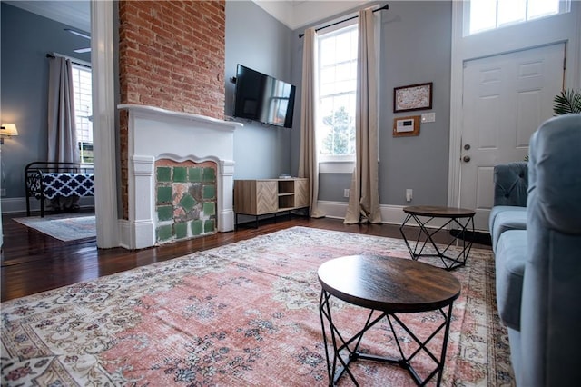 1529 Saint Philip St, New Orleans, LA 70116 - living room featuring healthy amount of natural light, wood finished floors, and baseboards