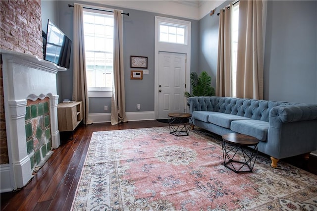 1529 Saint Philip St, New Orleans, LA 70116 - living room with healthy amount of natural light, dark wood-style flooring, baseboards, and crown molding