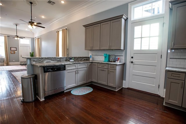 1529 Saint Philip St, New Orleans, LA 70116 - kitchen featuring stainless steel dishwasher, gray cabinetry, a peninsula, ornamental molding, and dark wood-type flooring