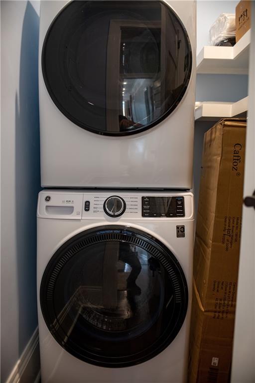 1529 Saint Philip St, New Orleans, LA 70116 - laundry area featuring stacked washer and clothes dryer