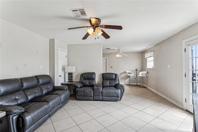 4901 Coronado Dr, New Orleans, LA 70127 - living room with visible vents, a ceiling fan, baseboards, and light tile patterned floors
