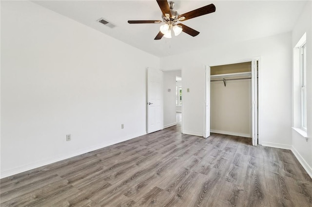131 Hickory St, Reserve, LA 70084 - unfurnished bedroom with wood finished floors, a closet, ceiling fan, baseboards, and visible vents