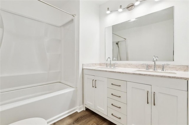 131 Hickory St, Reserve, LA 70084 - full bathroom with double vanity, wood finished floors, bathtub / shower combination, and a sink
